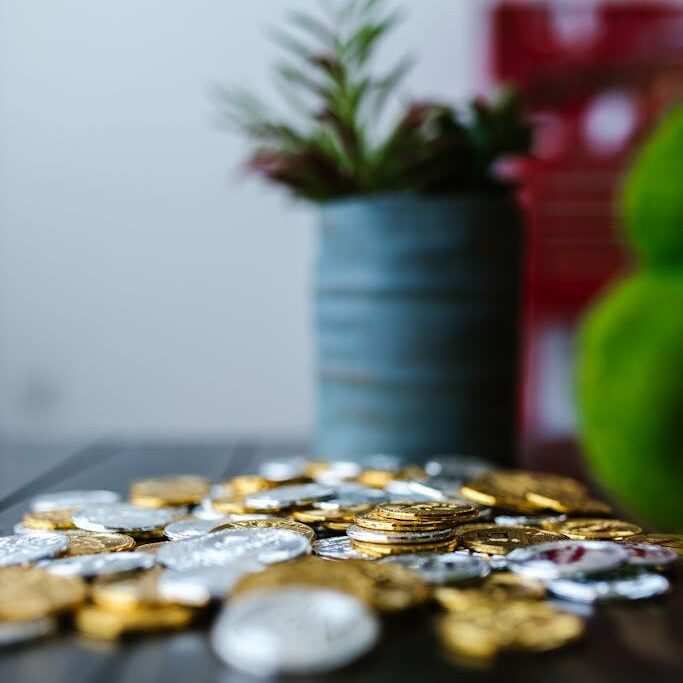 Gold and Silver Coins on a Wooden Surface